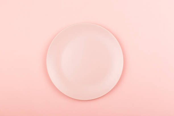 istock Pink plate on the pink background 1061638460