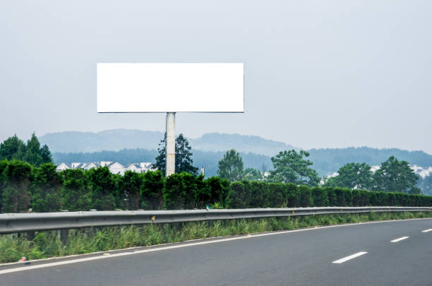 istock Blank billboard on blue sky background for new advertisement 1061638792