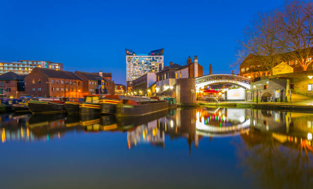 The cube behind brick buildings alongside a water channel in the central Birmingham, England The cube behind brick buildings alongside a water channel in the central Birmingham, England birmingham england photos stock pictures, royalty-free photos & images