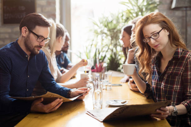 istock Happy colleagues from work socializing in restaurant 1061641668