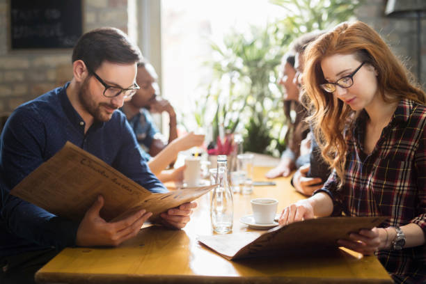 istock Happy colleagues from work socializing in restaurant 1061641670