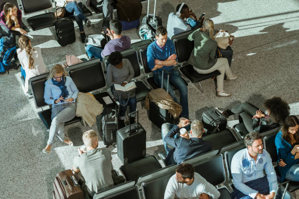 istock Business People In Departure Lounge 1061645166