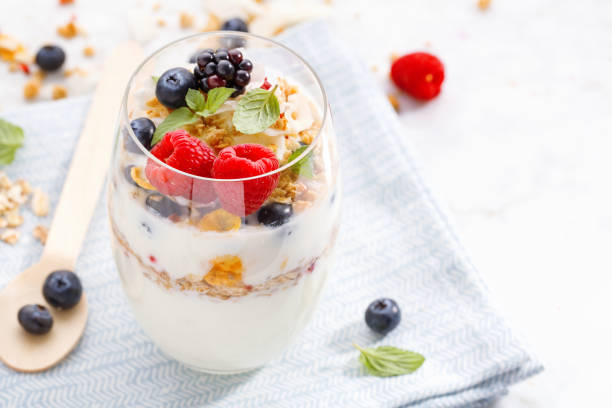 istock Yogurt with fresh berries served in glass 1061647330