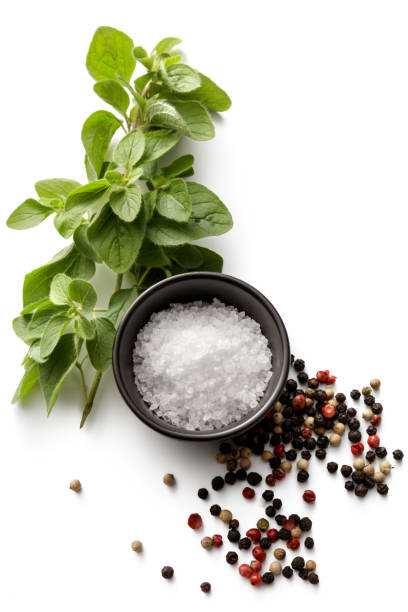 istock Seasoning: Salt, Oregano and Pepper Isolated on White Background 1061648090