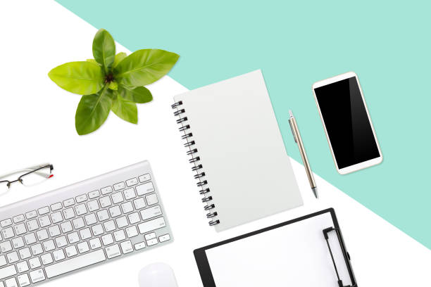 istock flat lay or top view workspace business green and white desk with laptop computer, office supplies tablet, cell phone and coffee cup using for background 1061649912