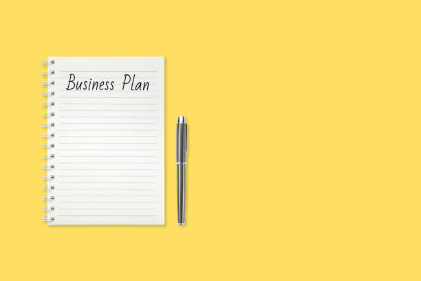 istock top view yellow pastel office desk with notebook, pen and copy space for your own text message 1061650526