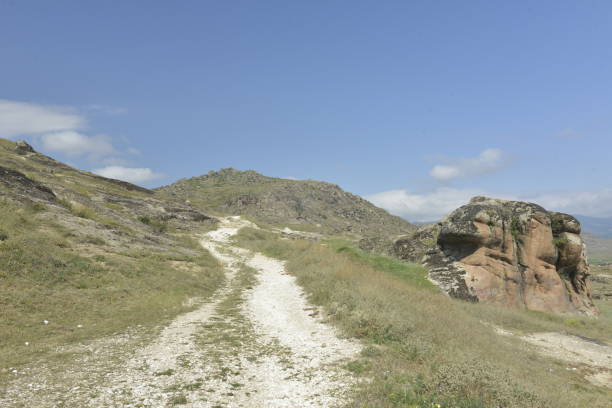 istock White mountain path that passes by the unusual rock 1061650668