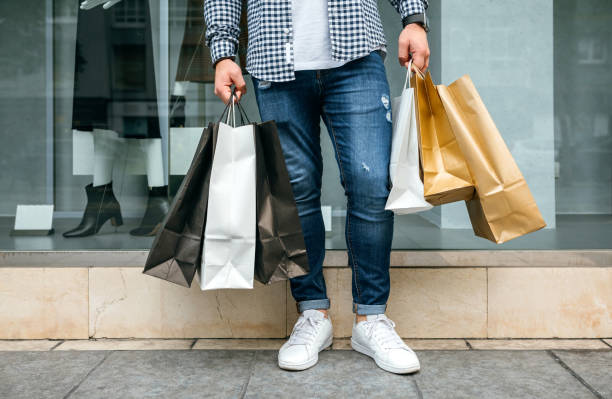 Low section of man shopping stock photo