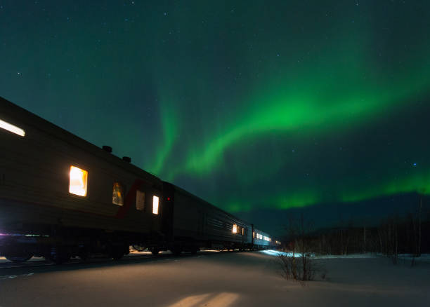 train and aurora borealis over the tundra train and aurora borealis over the tundra, Russia iceberg dramatic sky wintry landscape mountain stock pictures, royalty-free photos & images