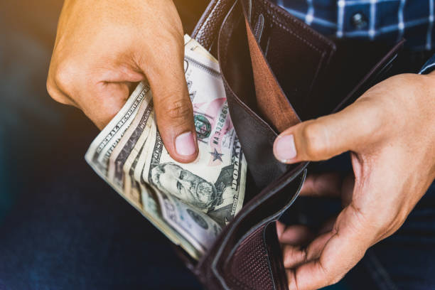 istock Money in wallet. 1061658590