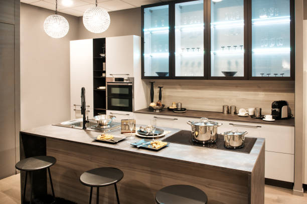 istock Neutral fitted kitchen with island and bar stools 1061658840
