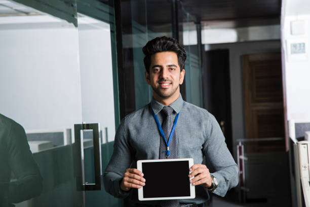 istock Smiling businessman at office - Stock image 1061660332