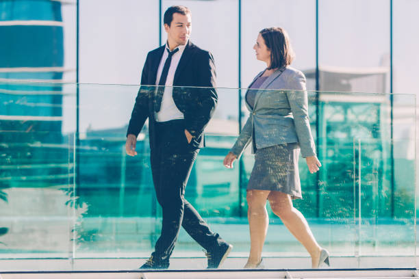 istock Confident successful business partners walking and talking 1061660874