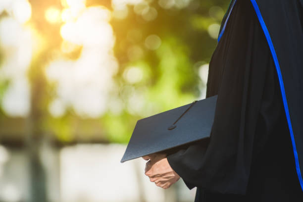 istock Close up Graduate holding a hat. Concept sucess education in University with copy space. 1061660908