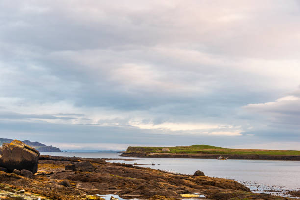 istock sunrise over Staffin coastal road 1061661420