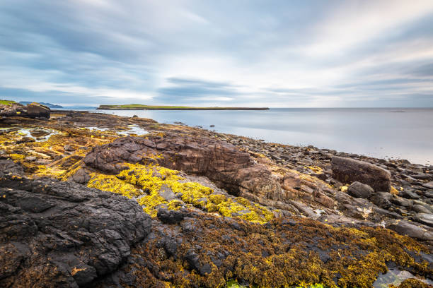istock sunrise over Staffin coastal road 1061661740