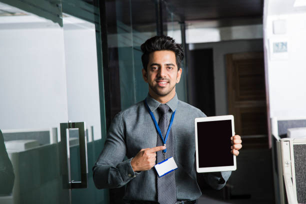 istock Smiling businessman at office - Stock image 1061662930