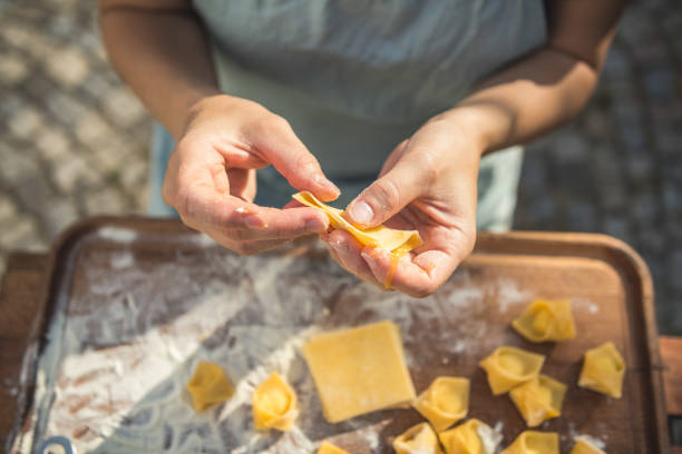 istock chef preparing handmade stuffed pasta tortellini 1061663334