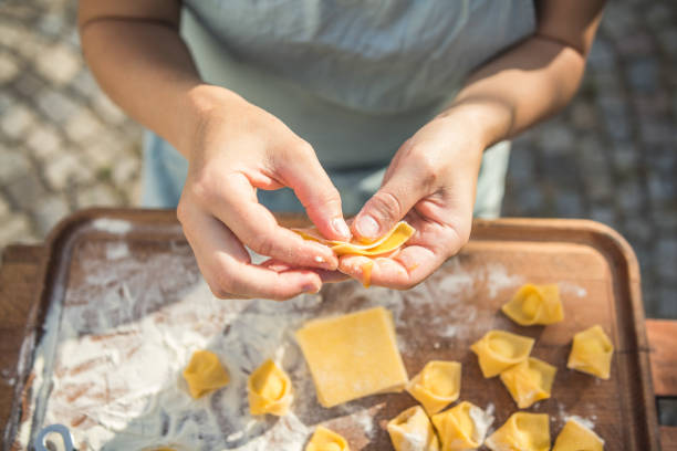 istock chef preparing handmade stuffed pasta tortellini 1061663350
