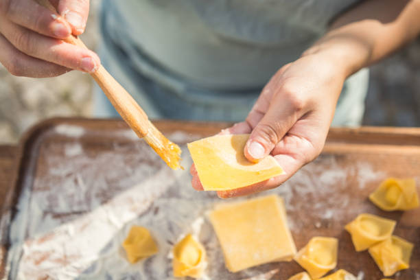 istock chef preparing handmade stuffed pasta tortellini 1061663432