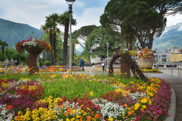 Merano/Italy - 05/05/18: in South Tyrol, a beautiful city of Trentino Alto Adige, View on the famous promenade along the Passirio river. Northern Italy stock photo