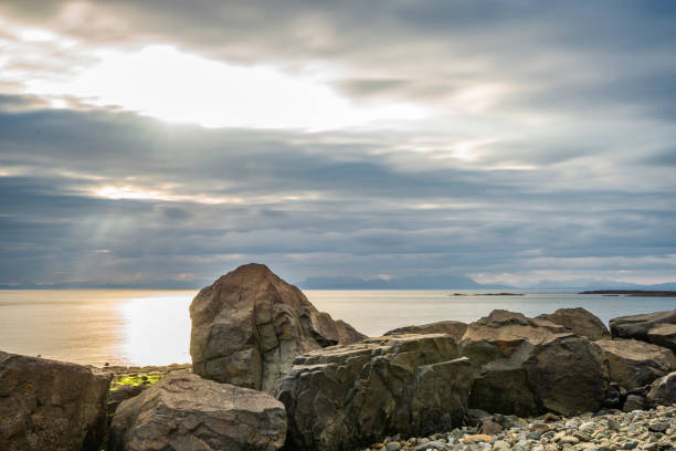 istock sunrise over Staffin coastal road 1061666232