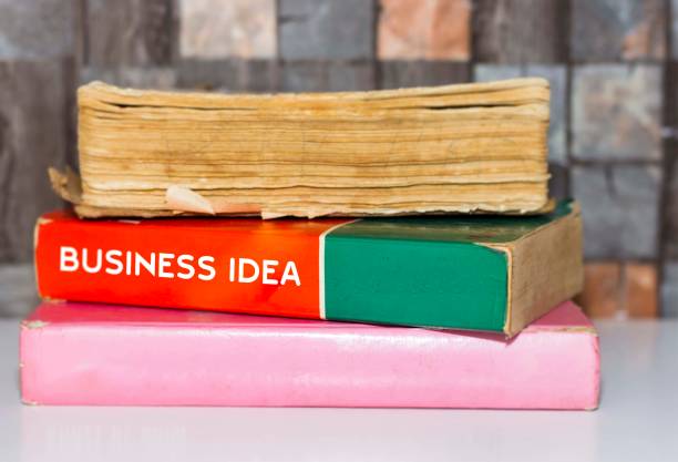 istock Business Idea - Business Book Title on wooden white table 1061666832