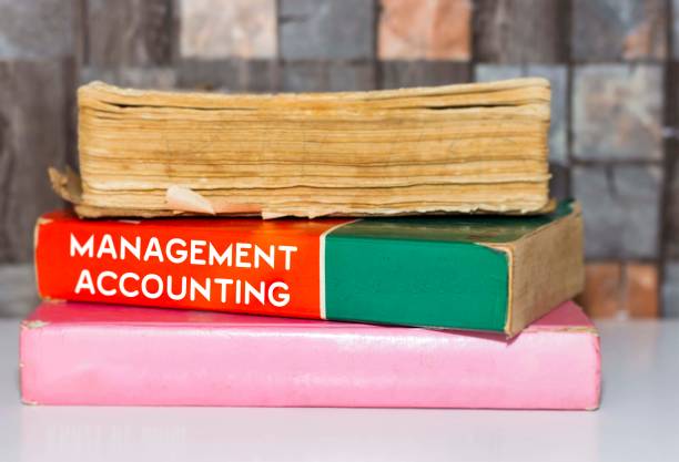 istock Management Accounting - Business Book Title on wooden white table 1061668320