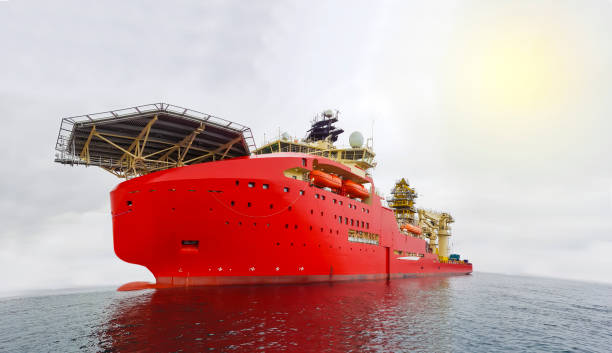 Aerial image of a large red Offshore diving support ship with a Helipad