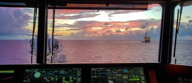 istock Amazing Sunset view from a modern ship over the oil field 1061674256