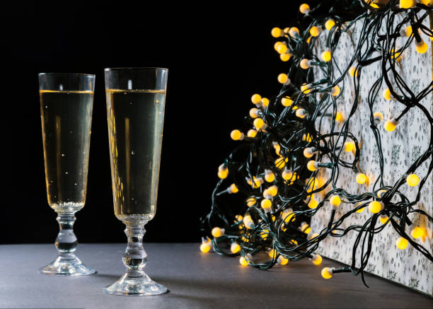 istock Two champagne glasses on Christmas. Defocused lights bokeh background. Romantic mood 1061676266