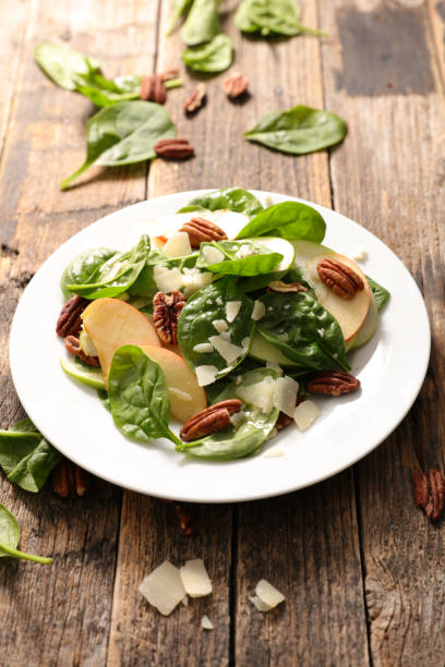 istock spinach salad with apple and pecan 1061676956