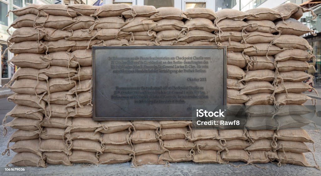 Historic plaque, checkpoint Charlie in Berlin, Germany Historic commemorative plaque at Checkpoint Charlie, the crossing point from West to East, in Berlin Germany. Berlin Stock Photo