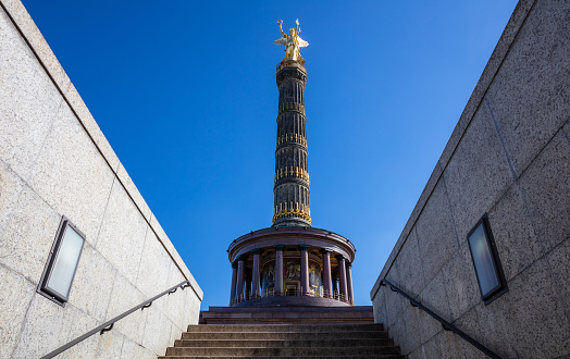 Victory column in Berlin, Germany against blue sky, wallpaper, low angle.
