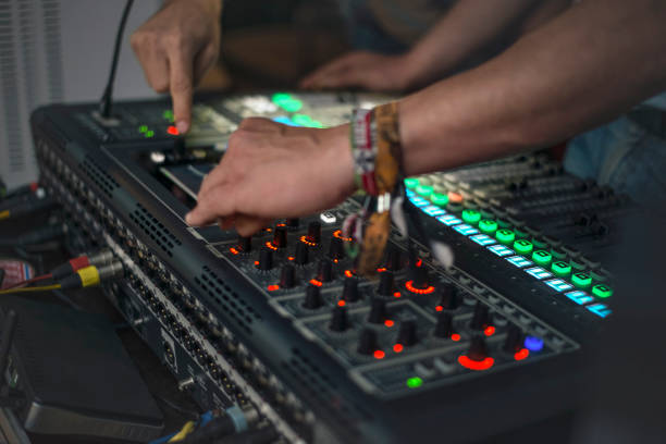 istock DJ tuning sound electronic equipment before a musical performance. 1061679226
