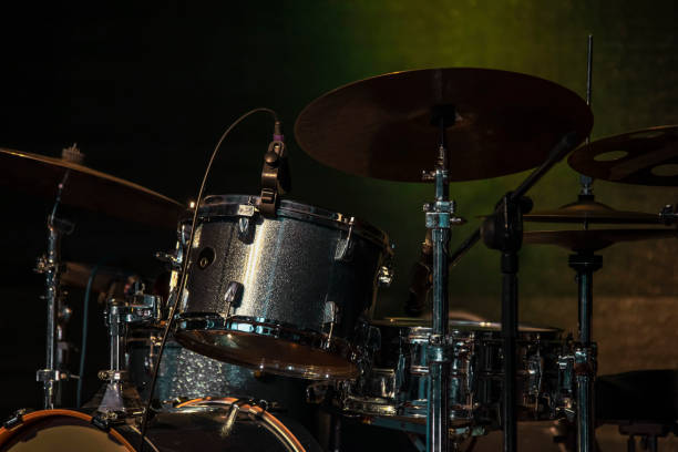 istock drum kit kit is on a lit stage ready for use before a musical concert, percussion musical instruments. 1061679416