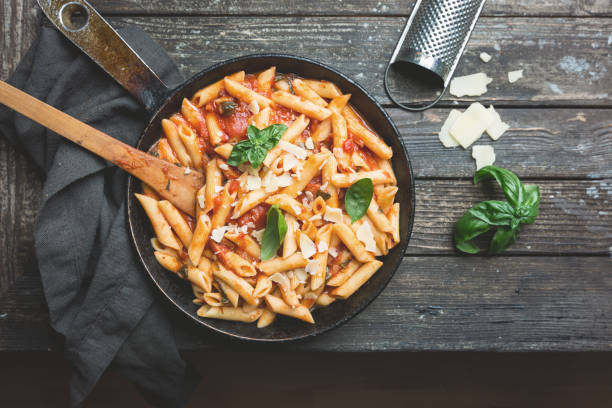 istock Penne pasta in tomato sauce 1061690360