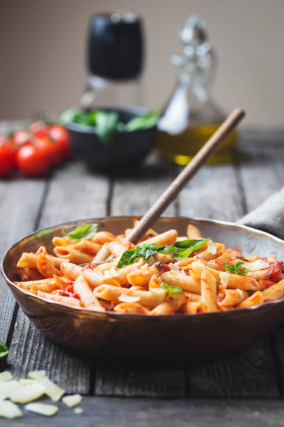 istock Penne pasta in tomato sauce 1061690420