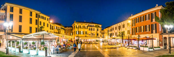 Sirmione, Italy - October 22: people in the famous old town with shops and restaurants on October 22, 218 in Sirmione, Italy