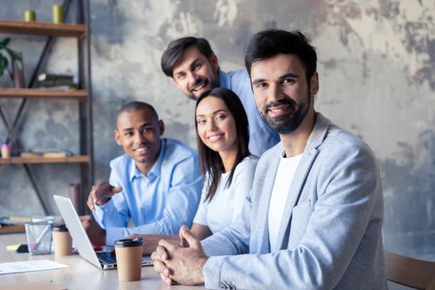 istock Successful company with happy workers in modern office. 1061693466