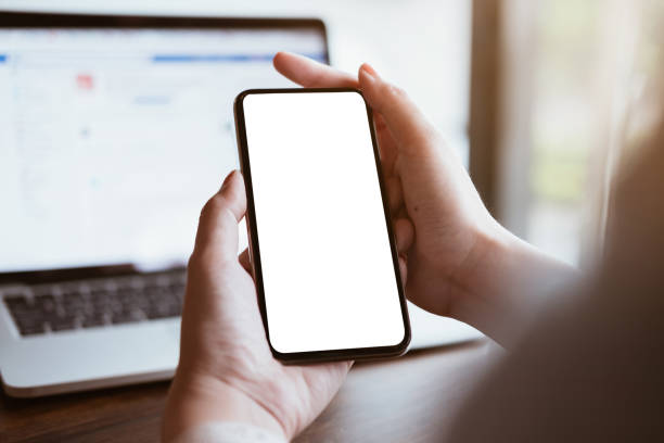 istock woman using Smartphone. Blank screen mobile phone for graphic display montage.networking service. 1061695258