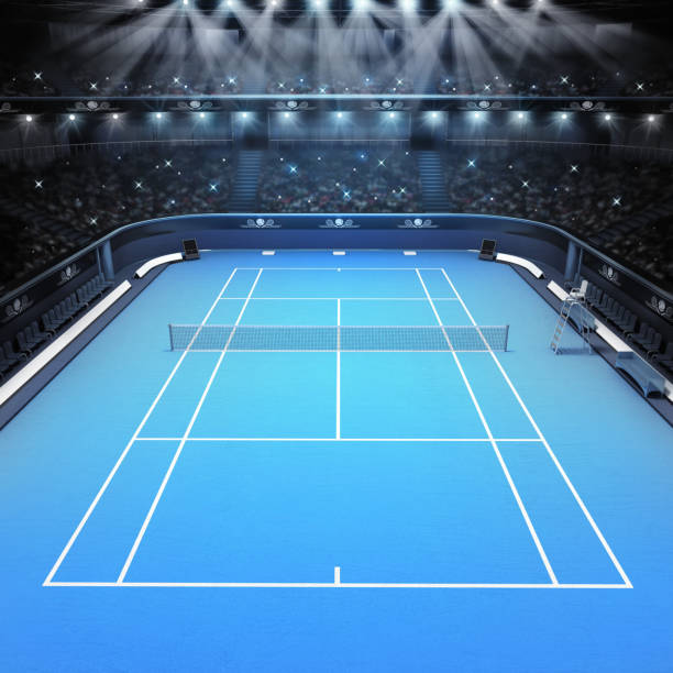 pista de tenis superficie dura azul y estadio lleno de espectadores con focos - tennis court tennis net indoors fotografías e imágenes de stock