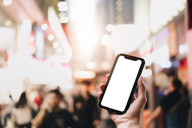 istock Close up Woman hand Using a Smart Phone with blank screen at shopping mall. 1061697404