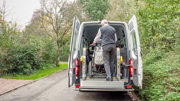 istock A senior retired man helping to transport disabled people 1061700342