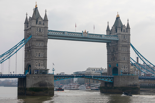 London, UK - Feb 21, 2018: London's Tower Bridge, a suspension bridge that crosses the Thames River was finished in 1894 It is an iconic symbol of London.