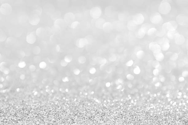 istock abstract background white Silver lights on christmas bokeh 1061713270