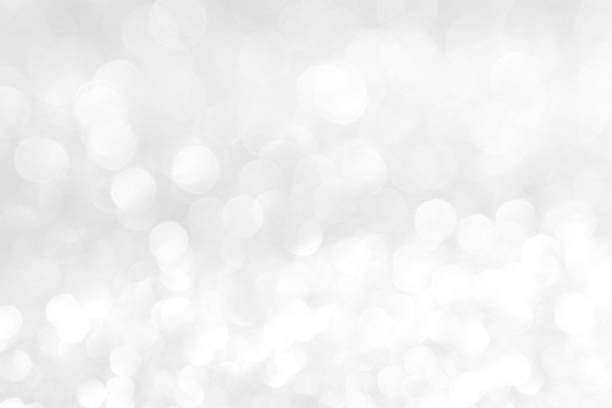 istock abstract background white Silver lights on christmas bokeh 1061713324