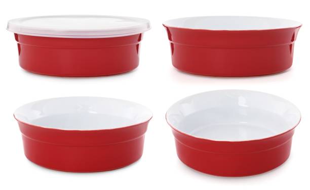 istock Empty red bowls isolated on white background.  Set of deep plate 1061714432