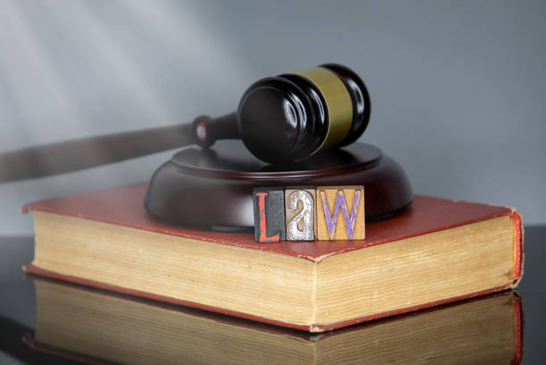 Law word from colored wooden letters Law word from colored wooden letters. judge's gavel and book on gray background. Court and the law concept probate steps stock pictures, royalty-free photos & images
