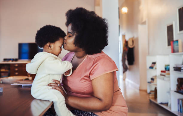 istock Babies can never have enough of mommy's kisses 1061715912